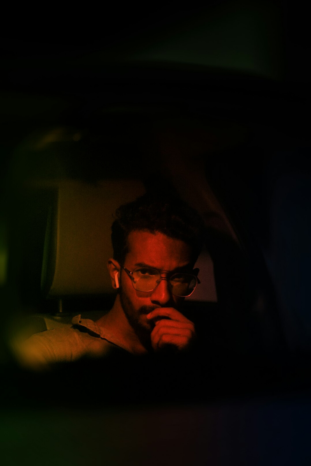 Studio portrait of a bearded man in glasses