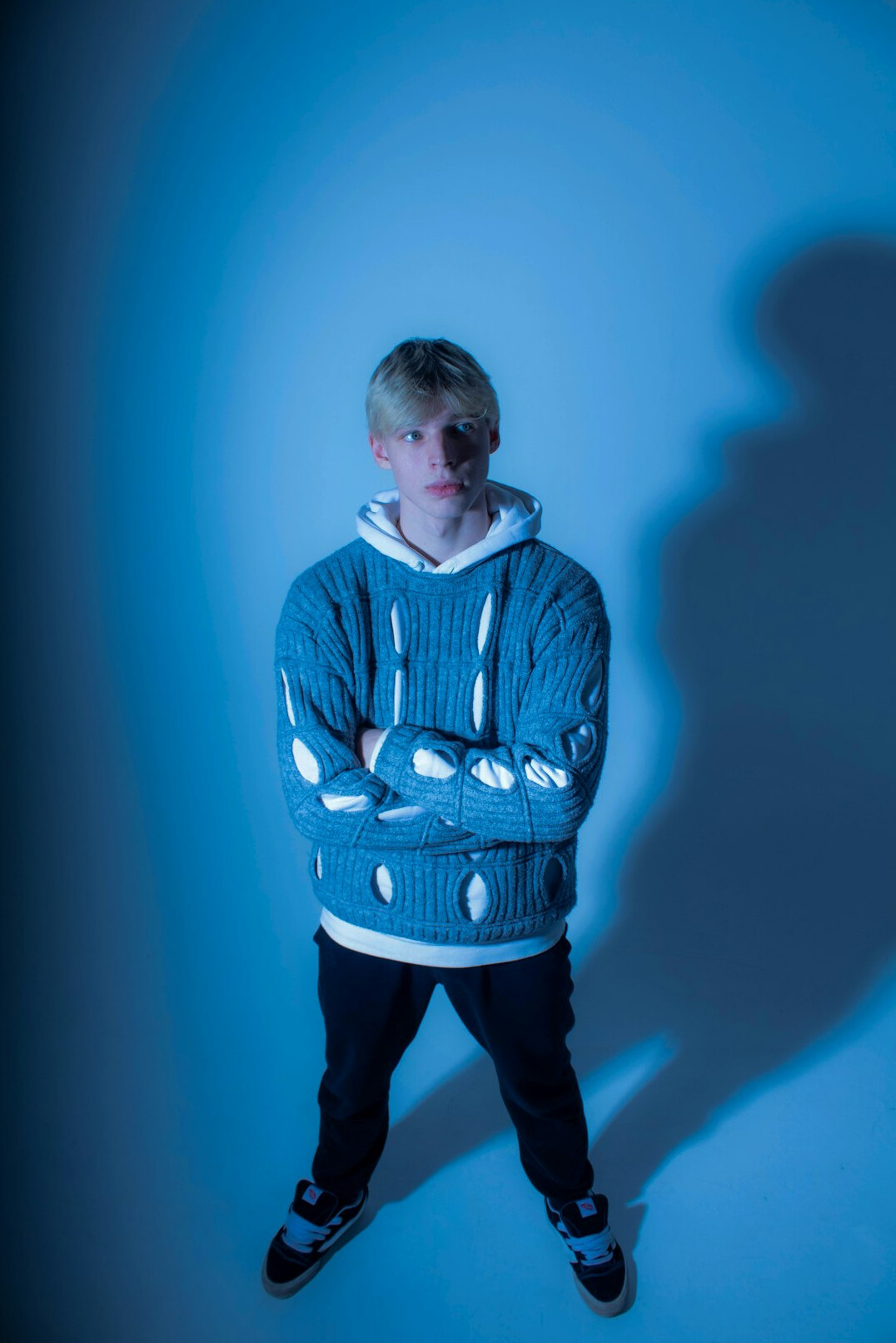 Studio portrait of a young man in a sweater